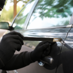 Slim Jim Tool near a locked car door with focus on lockout risks and safer alternatives